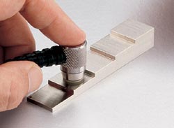 Recalibratura del misuratore di spessore di materiale.